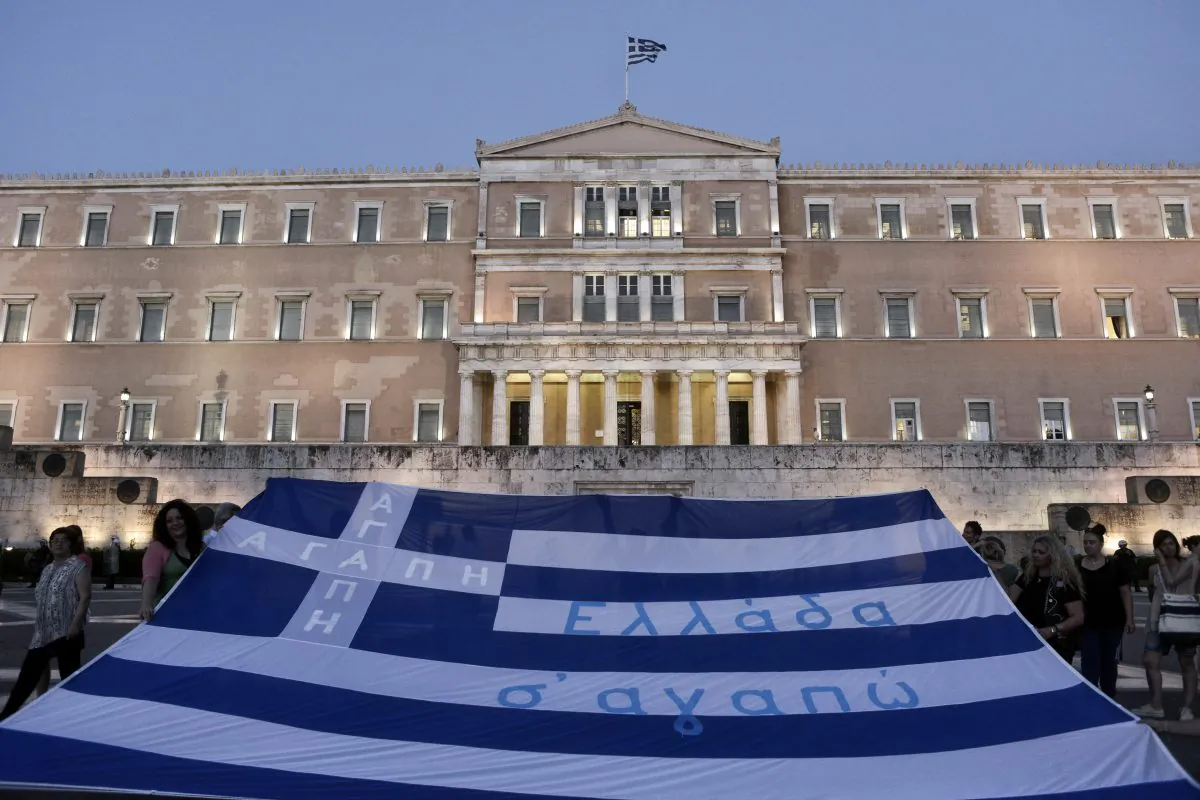 Demonstrators display the Greek flag in front of parliament on July 15, 2015 in Athens, Greece. (Milos Bicanski/Getty Images)