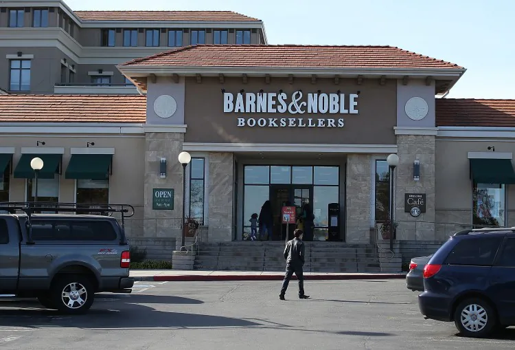 A pedestrian walks by a Barnes and Noble bookstore on Jan. 28, 2013 in Corte Madera, California. (Justin Sullivan/Getty Images)