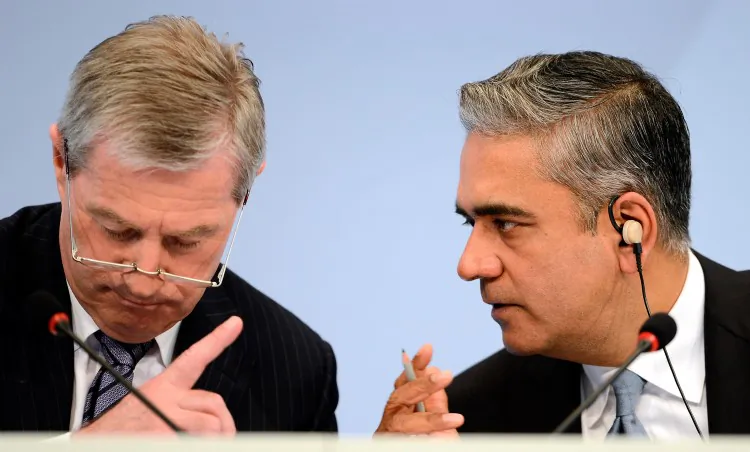 Juergen Fitschen (L) and Anshu Jain (R), Co-CEOs of Deutsche Bank, speak during the company's annual press conference to announce its 2012 financial results in Frankfurt, Germany, Jan. 31. Deutsche Bank announced a fourth quarter, pre-tax loss of $3.5 billion, largely due to restructuring and litigation costs. (Thomas Lohnes/Getty Images)