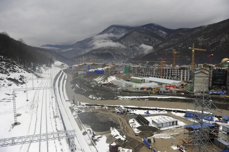A picture taken on Jan. 23, 2013 shows a railway and the construction site of the work on the Media Village the Winter Olympic Games in Sochi. (Mikhail Mordasov/AFP/Getty Images)