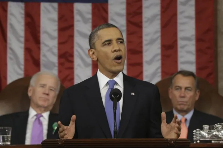President Barack Obama, flanked by Vice President Joe Biden and House Speaker John Boehner of Ohio, during his State of the Union address in Washington, Feb. 12. Obama proposed beginning negotiations on a transatlantic free trade zone. (Charles Dharapak/AFP/Getty Images)