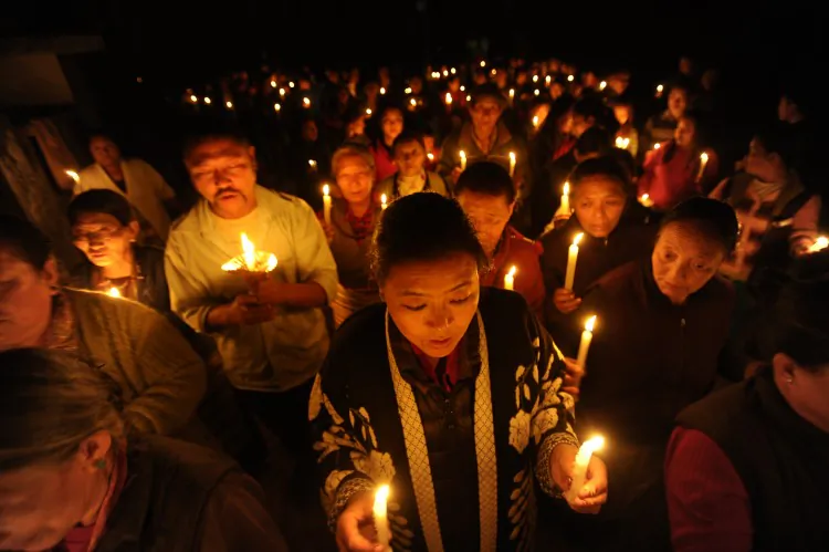 Tibetans-in-exile take part in a candlelight vigil following the self-immolation attempt by a monk earlier today, marking the one hundredth Tibetan to self immolate in protest against Chinese rule in Tibet, in Kathmandu on Feb. 13, 2013. (Prakash Mathema/AFP/Getty Images)
