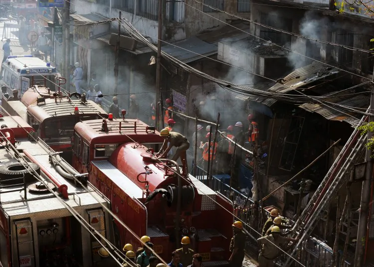 Indian firefighters work at the scene of a blaze at the Surya Sen market building in Kolkata on February 27, 2013. (Dibyangshu Sarkar/AFP/Getty Images)