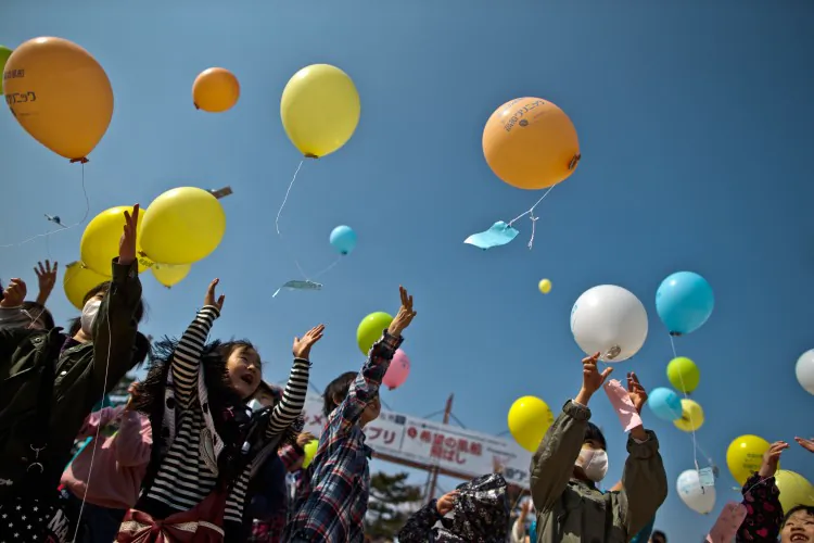 Children float balloons during the second anniversary commemoration of the earthquake and tsunami on March 10, 2013, in Minamisoma, Japan. (Athit Perawongmetha/Getty Images)