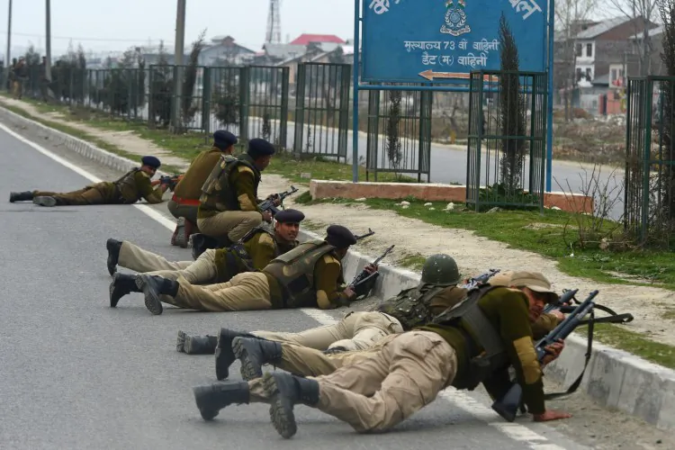 Indian paramilitary personnel take positions outside a school after an attack against Indian paramilitary personnel in Srinagar on March 13, 2013. (TAUSEEF MUSTAFA/AFP/Getty Images)