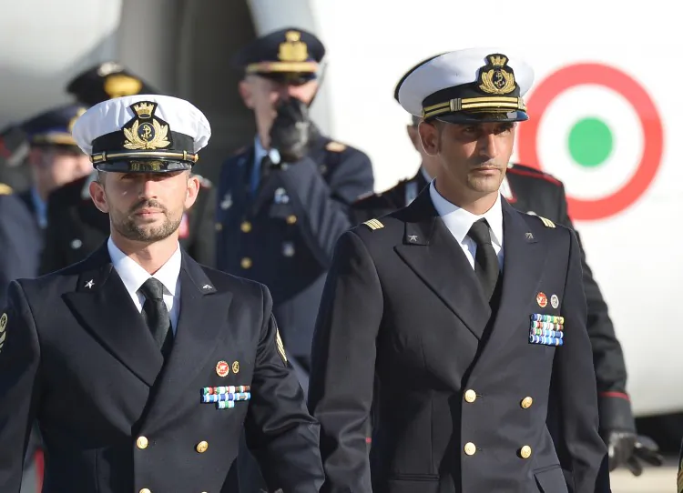 Italian marines Massimiliano Latorre (R) and Salvatore Girone (L) arrive at Ciampino airport near Rome. Italy. (22/12/2012/VINCENZO PINTO/AFP/Getty Images)