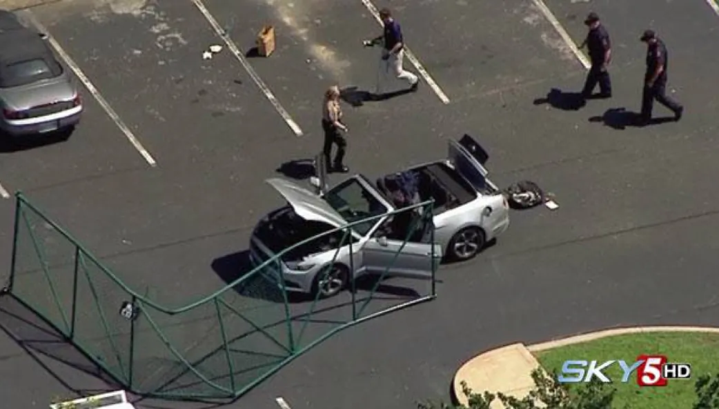 In this aerial image taken from video, law enforcement personnel work the scene of a shooting at the Navy Operational Support Center and Marine Corps Reserve Center Chattanooga Thursday, July 17, 2015, in Chattanooga, Tenn. (WTVF via AP) 