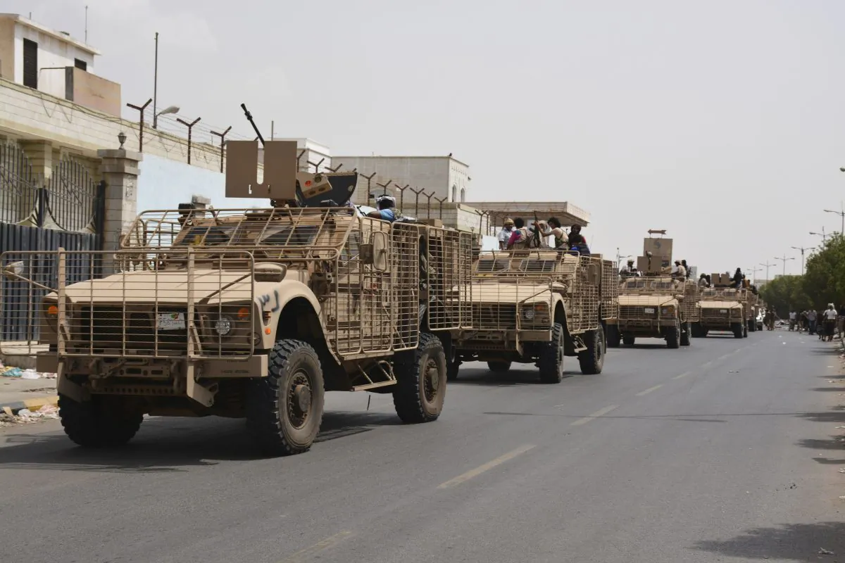 Yemeni fighters against Shiite rebels ride military vehicles on a street in the port city of Aden, Yemen, Tuesday, July 14, 2015. Yemeni forces battling the Shiite rebels in the country's south said they took control on Tuesday of the airport in the strategic port city of Aden, driving the Houthi rebels there into a part of the city jutting out into the sea. (AP Photo/Abo Muhammed)