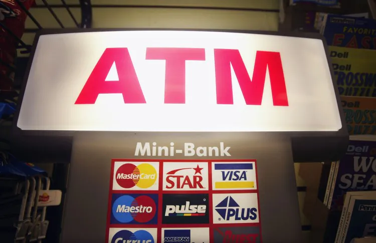 A college student received $1,800 by mistake at an ATM machine in Delaware. He returned the money. Other people around the world experienced ATM mistakes, as well. Yet, not everyone returned the money. (Mario Tama/Getty Images)