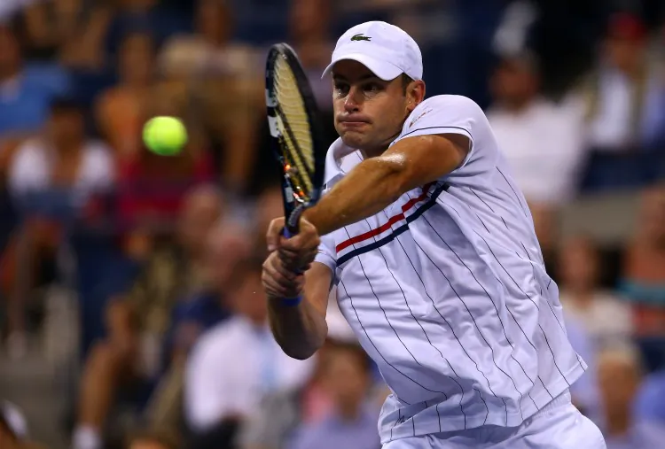 Andy Roddick returns a shot during his men's singles fourth round match against Juan Martin Del Potro of Argentina on Day Nine of the 2012 US Open. (Elsa/Getty Images)