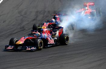 Smoke pours out of Jaime Alguersuari's Toro Rosso on lap two of the Formula One Hungarian Grand Prix. (Fred Dufour/AFP/Getty Images)