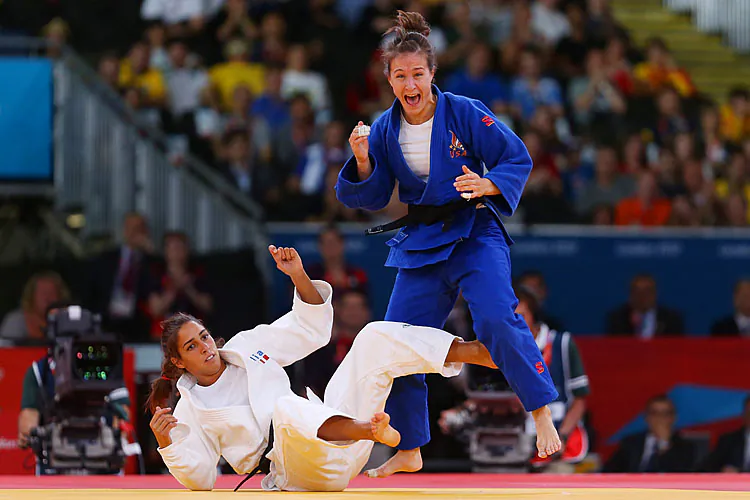 Marti Malloy of the United States celebrates winning the bronze medal A against Giulia Quintavalle of Italy in the Women's -57 kg Judo on Day 3 of the London 2012 Olympic Games. (Julian Finney/Getty Images)