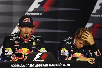 (L-R) Mark Webber and Sebastian Vettel display very different body language at the post-race press conference after the F1 Hungarian Grand Prix. (Mark Thompson/Getty Images)