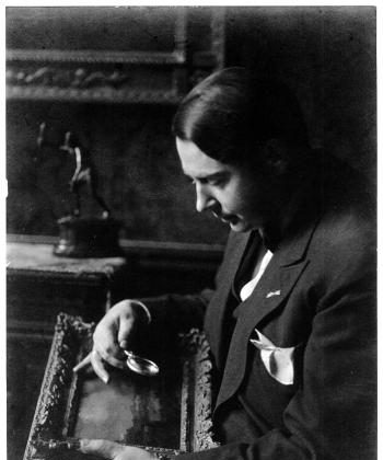 Photograph of Jacques Goudstikker (1897-1940) inspecting a painting ((Courtesy The Bruce Museum))