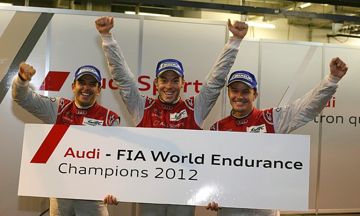 Benoît Tréluyer, André Lotterer, and Marcel Fässler celebrate winning the 2012 WEC drivers’ championship. (Audi Motorsport)