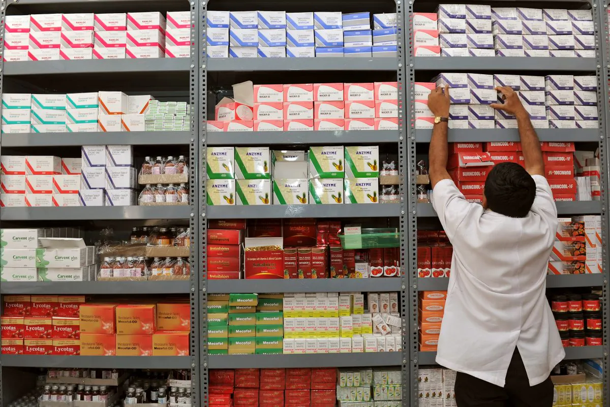 An Indian pharmacist pulls out a box of medicines from a shelf at a Generic Drug Store at the Victoria Hospital in Bangalore on June 28, 2012. (Manjunath Kiran/AFP/GettyImages)