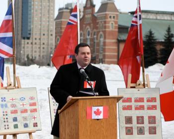 Jason Kenney, Minister of Citizenship, Immigration and Multiculturalism, speaks at a flag-raising ceremony at Ottawa City Hall on Feb. 15, 2010, in honour of National Flag of Canada Day and the 45th anniversary of the iconic Canaidan maple leaf flag. (Gerry Smith/The Epoch Times)