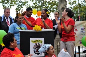 A young female speaker makes the crowd laugh at Make the Road New York's fundraising walk and picnic last September in Queens. (Courtesy of Make the Road New York) A young female speaker makes the crowd laugh at Make the Road New York's fundraising walk and picnic last September in Queens. (Courtesy of Make the Road New York)