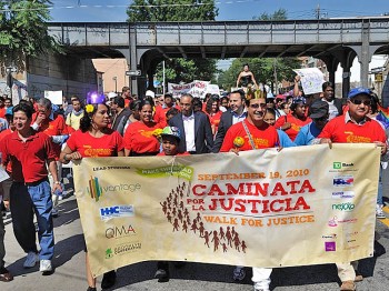 Participants walk on the road as part of Make the Road New York's fundraising walk last year in Queens. (Courtesy of Make the Road New York) Participants walk on the road as part of Make the Road New York's fundraising walk last year in Queens. (Courtesy of Make the Road New York)