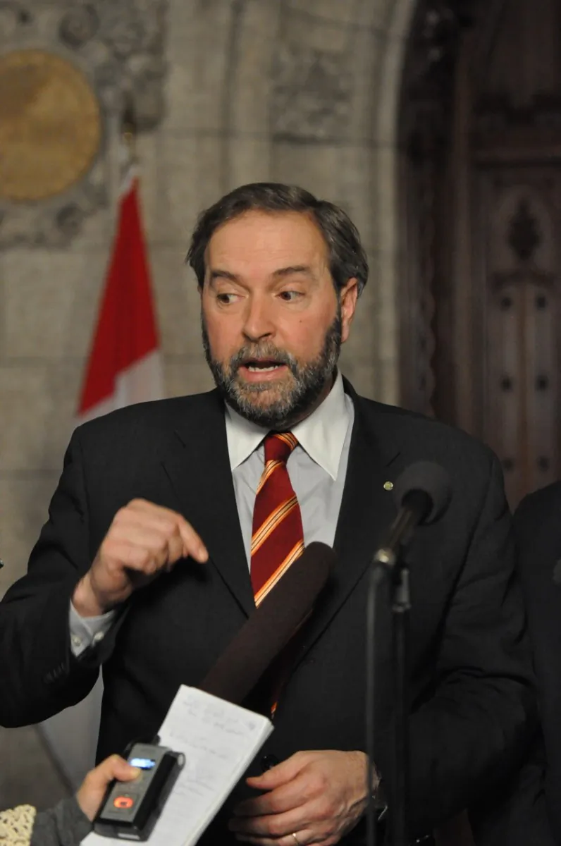 Thomas Mulcair, the perceived front-runner in the race to lead the New Democratic Party, speaks to reporters on Parliament Hill last year. (Matthew Little/The Epoch Times)