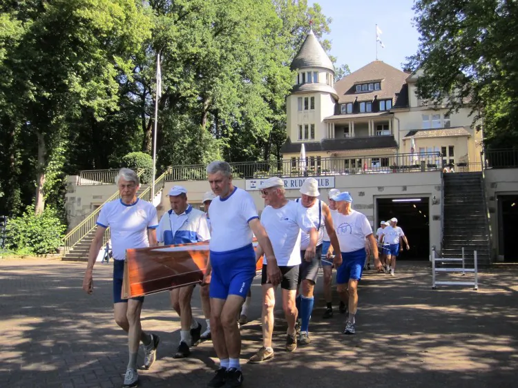 Jürgen Oelke (L) and Egbert Hirschfelder (R), Olympic gold medalists for rowing (Tokyo 1964), stand in front of the dock of the Berlin Rowing Club, the most successful rowing club of Germany, on Aug 1. (Christian Watjen/The Epoch Times)
