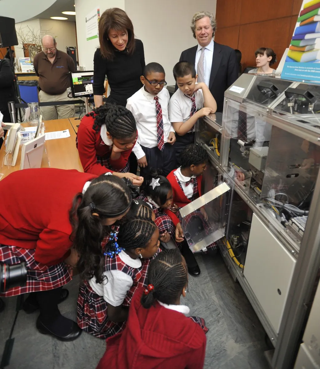 Third-graders watch as children's books are printed with the Espresso Book Machine at the Brooklyn Public Library on Wednesday. (Phillip Greenberg/Courtesy of Berlin Rosen)