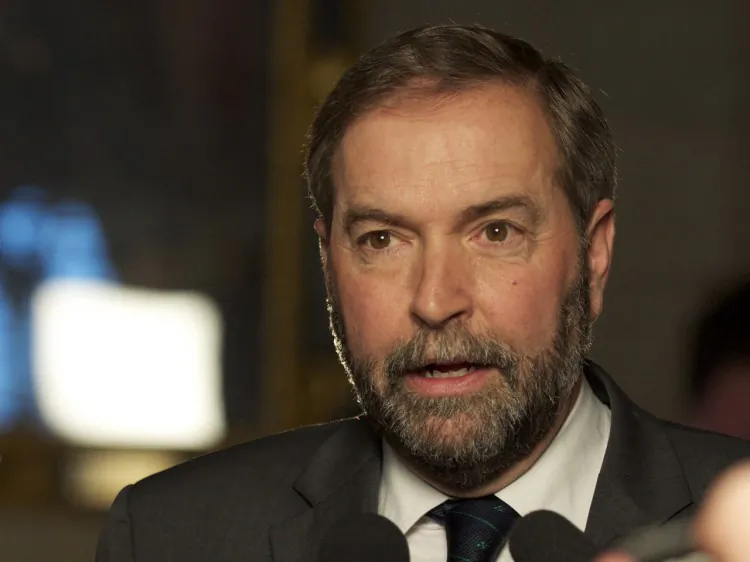 Newly anointed NDP leader Thomas Mulcair speaks with reporters after his first day in Parliament. With the looming prospect of Tory attack ads, the NDP are prepared to defend the image of their leader. (Matthew Little/The Epoch Times)