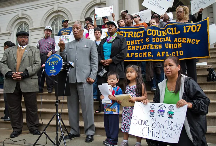 Council member Charles Barron speaks at a protest against the mayor's scheduled cuts for subsidized child care and the Head Start program on the steps of City Hall on May 23. (Benjamin Chasteen/The Epoch Times)