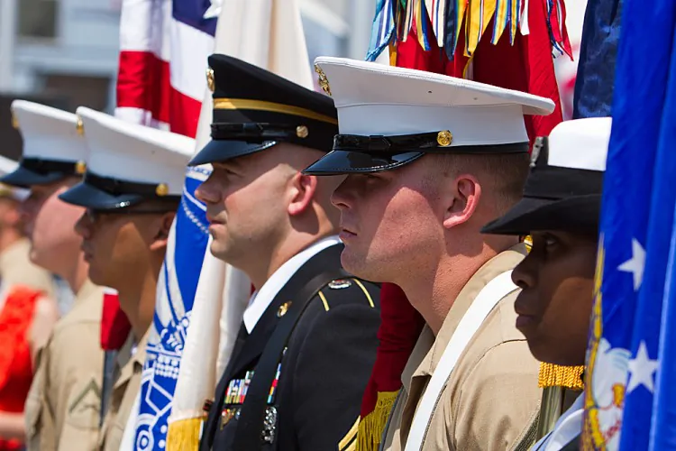 Military personnel standing at attention for the Memorial Day service at the Intrepid Museum on May 28, in New York. (Benjamin Chasteen/The Epoch Times)