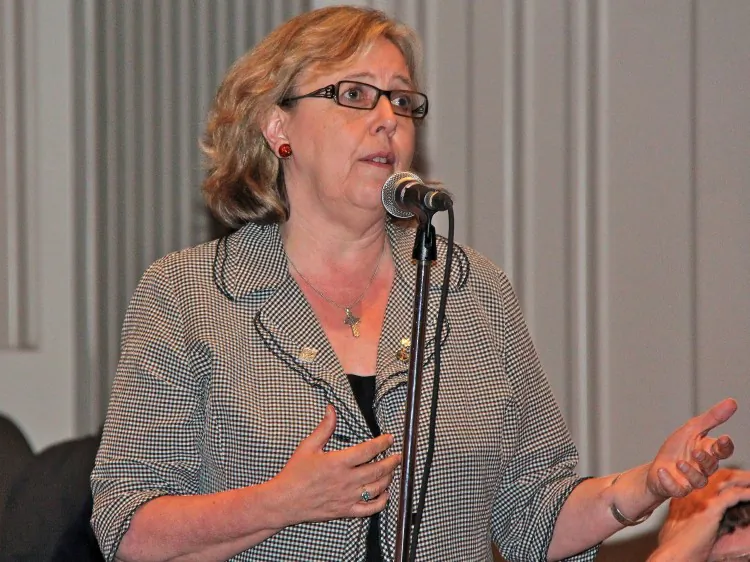 Green Party leader Elizabeth May asks a question at a documentary screening and panel discussion May 28 at Library & Archives Canada in Ottawa. The Green Party is calling for Canadians to demand accountability from the government and business community for human rights abuses in nations that do trade with Canada. (Pam McLennan/The Epoch Times)