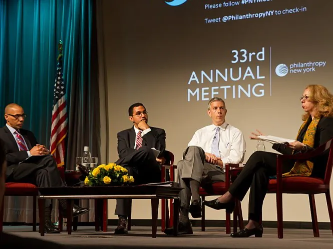 (From L to R) NYC Schools Chancellor Dennis Walcott, New York State Education Commissioner John B. King Jr., and U.S. Secretary of Education Arne Duncan, with moderator Beth Fertig, WNYC’s education reporter, discuss education and philanthropic giving on Monday in Midtown. (Benjamin Chasteen/The Epoch Times)