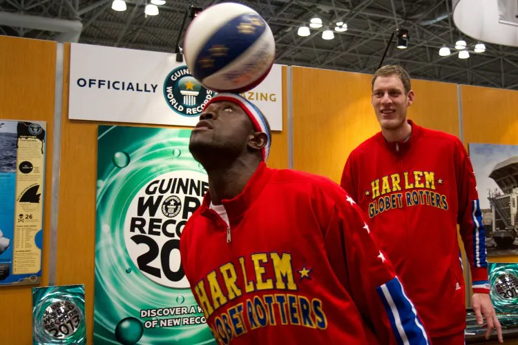 A fan poses with "Special K Daley" (L) and "Tiny Sturgess" after Daley attempted entry into the Guinness Book of World Records. (Benjamin Chasteen/The Epoch Times)