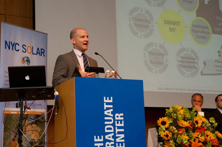 Chris O'Connor, vice president Industry Solutions Software, IBM Smarter Cities, speaks at the NYC Solar 2012 summit in Manhattan June 7. (Benjamin Chasteen/The Epoch Times)
