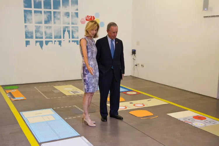 Amanda Burden, chair of the City Planning Commission, shows Mayor Michael Bloomberg an example of a micro-apartment, on July 9 at the Center for Architecture. (Benjamin Chasteen/The Epoch Times)