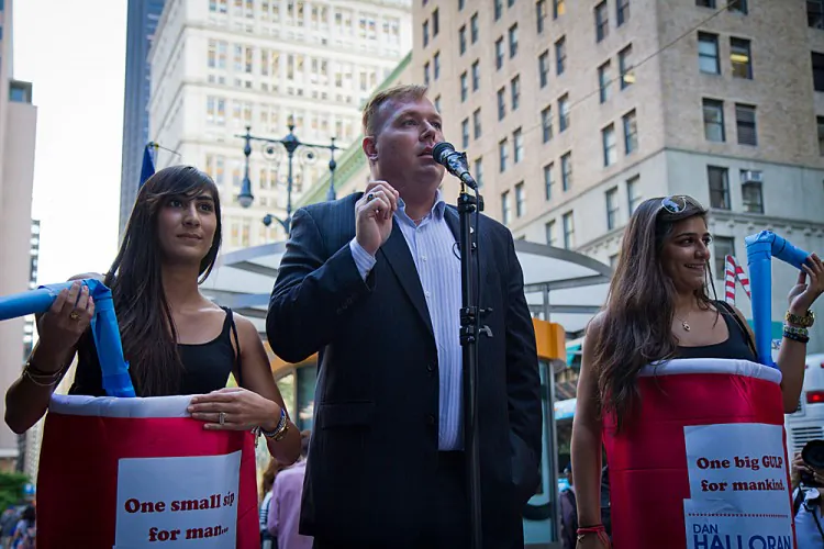 Eric Moor from Staten Island drinks an Extreme Gulp from 7-Eleven filled with Gatorade to protest Mayor Bloomberg’s soda ban in Manhattan on July 9. (Benjamin Chasteen/The Epoch Times)