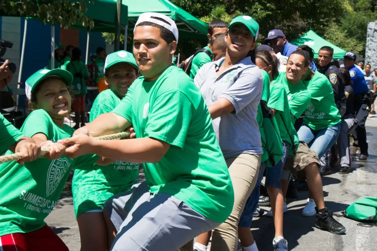 Children in the Police Athletic League (PAL) participate in outdoor activities with the NYPD on Tuesday in Manhattan. (Benjamin Chasteen/The Epoch Times)