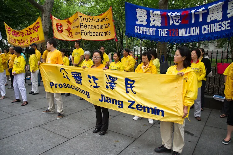 Falun Gong practitioners hold signs showing how long they were illegally detained in prison camps in China for practicing Falun Gong. On Friday they attended a rally in front of City Hall in Manhattan. (Benjamin Chasteen/The Epoch Times)