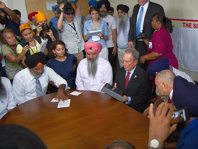NYPD Police Commissioner Ray Kelly and New York City Mayor Michael Bloomberg offer their condolences at the Sikh temple in Richmond Hill, Queens, Monday, Aug. 6, in the wake of the Sikh Wisconsin shooting on Sunday which left six dead and three injured. (Benjamin Chasteen/The Epoch Times)