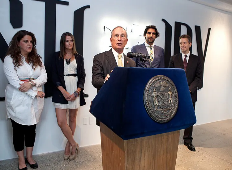 Mayor Michael Bloomberg receives a t-shirt after kicking off Fashion Week on Wednesday. (Amal Chen/The Epoch Times)