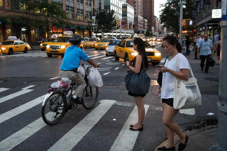 Community outreach staff with the city's Department of Transportation give a presentation about commercial biking rules to restaurant owners Wednesday at Havana Central in Times Square. (Benjamin Chasteen/The Epoch Times)
