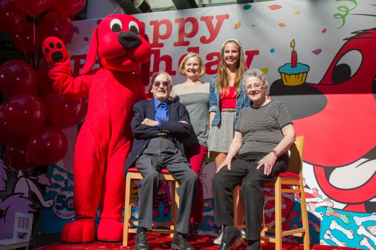 Norman Bridwell, creator of the Clifford children's book series, stands with Clifford for Clifford's 50th party in New York City on Sept. 20. (Benjamin Chasteen/The Epoch Times)