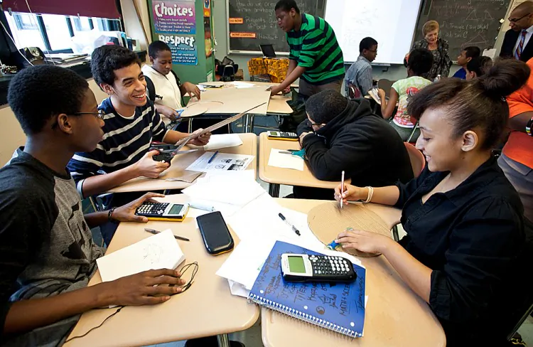 Students at P-TECH high school in Brooklyn, New York, build a ferris wheel as part of their interactive instruction during a tenth grade algebra and trigonometry class on Oct. 23, 2012. (Amal Chen/The Epoch Times)