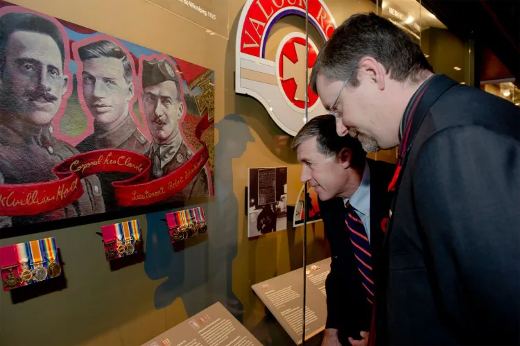 Eric Clarke and Doug Cargo admire the new display of three Victoria Cross Medals awarded during the First World War to residents of Winnipeg’s Valour Road. The medals were unveiled at the Canadian War Museum Nov. 5 and will remain on permanent display in the Royal Canadian Legion Hall of Honour. (CNW Group/Canadian War Museum)