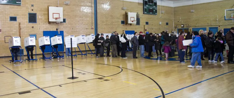 People line up waiting to vote for the presidential election at MS 51 middle school in Brooklyn, New York City, on Nov. 6. Many people complained that it took longer then two hours to vote. (Benjamin Chasteen/The Epoch Times)