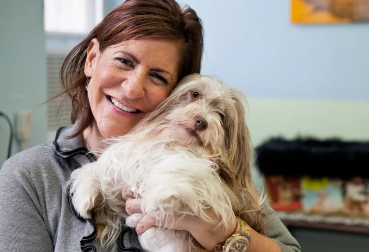 Anne-Marie Karash, the associate director of the no-kill shelter at the Humane Society of New York, speaks about the adoption center as she holds Tulip, an emaciated boxer, on Nov.8. (AMAL CHEN/THE EPOCH TIMES)