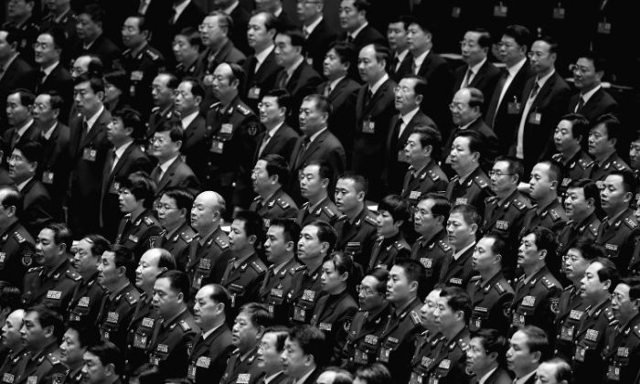 Delegates attend the opening session of the 18th Communist Party Congress held at the Great Hall of the People on Nov. 8, 2021, in Beijing, China. Many Party officials have found themselves wiretapped recently, as paranoia in the ranks increases amidst an anti-corruption campaign led from the top. (Feng Li/Getty Images)