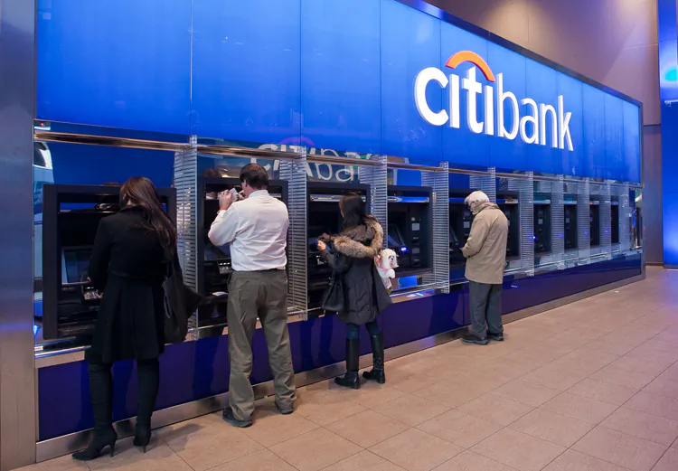 People use the ATM machines at a Citibank branch in New York City, Nov. 14. U.S. banking giant Citigroup announced Dec. 5 that it plans to lay off 11,000 staff worldwide. (Amal Chen/The Epoch Times)