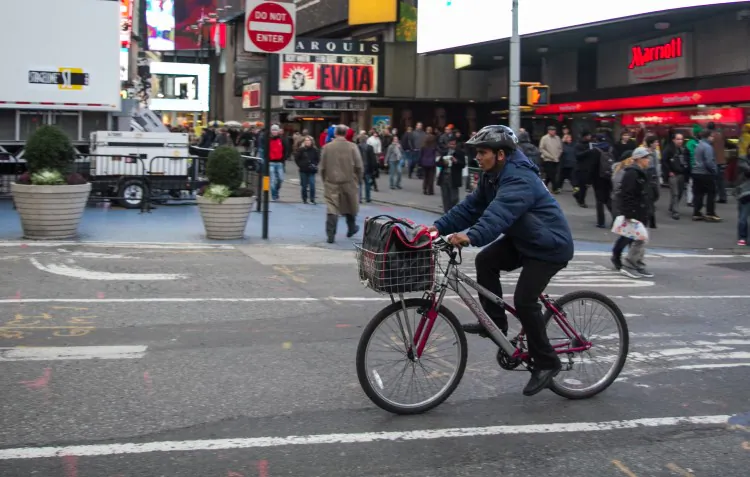 The dotted bike lanes, installed this year, could be extended westward to the Hudson Greenway, according to a proposal unveiled by the Department of Transportation Thursday. (DOT)