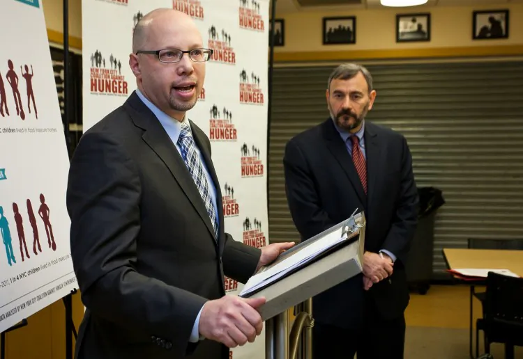 Stephen Grimaldi (L), executive director of Yorkville Common Pantry, and Joel Berg (R), New York City Coalition Against Hunger executive director, during a conference held by the coalition at Yorkville Common Pantry on in New York on Nov. 20, 2012. (Samira Bouaou/The Epoch Times)