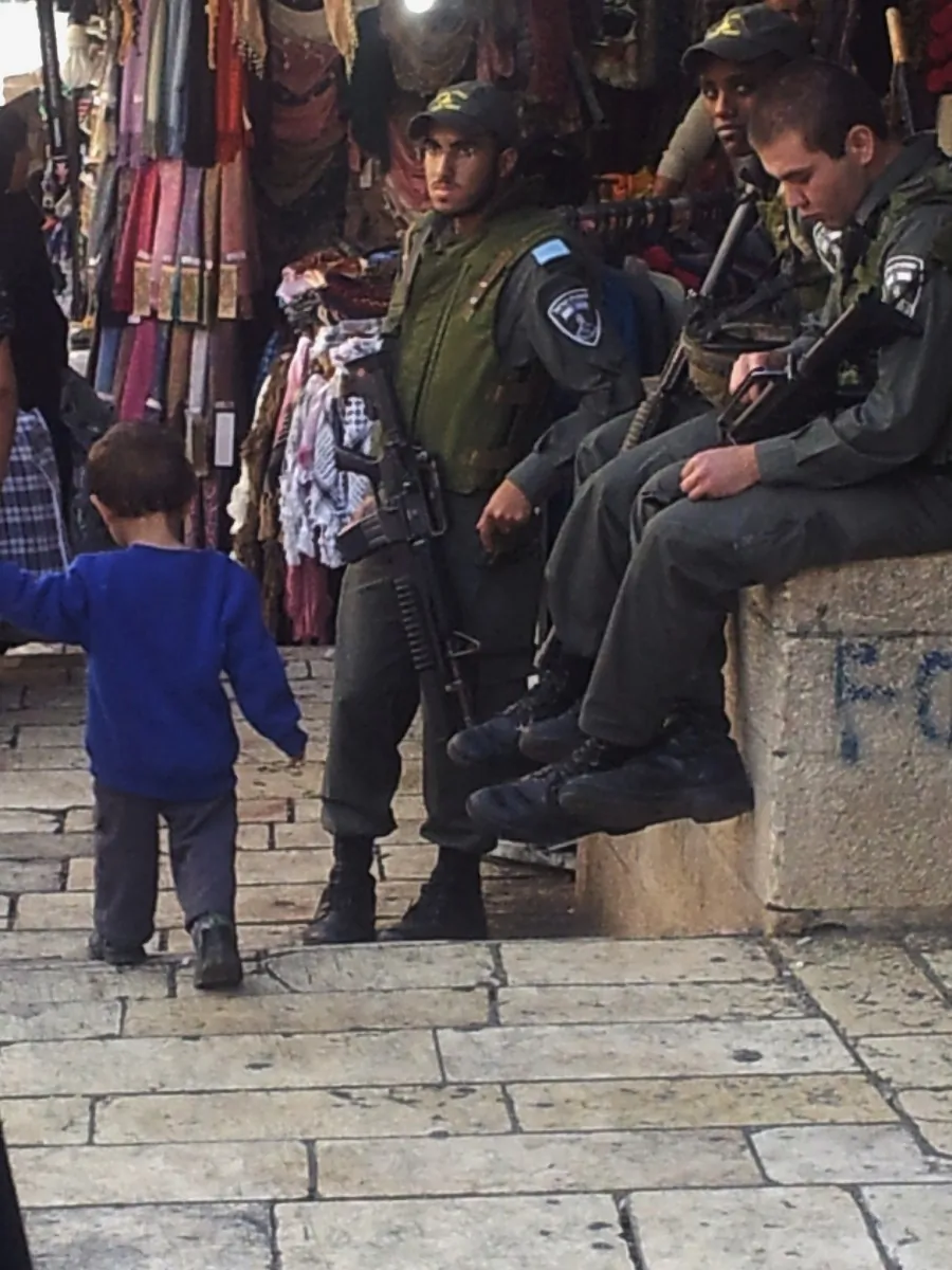 Israeli soldiers are stationed in the Arab section of Jerusalem's Old City, on Nov. 20, 2012. (Genevieve Belmaker/The Epoch Times)